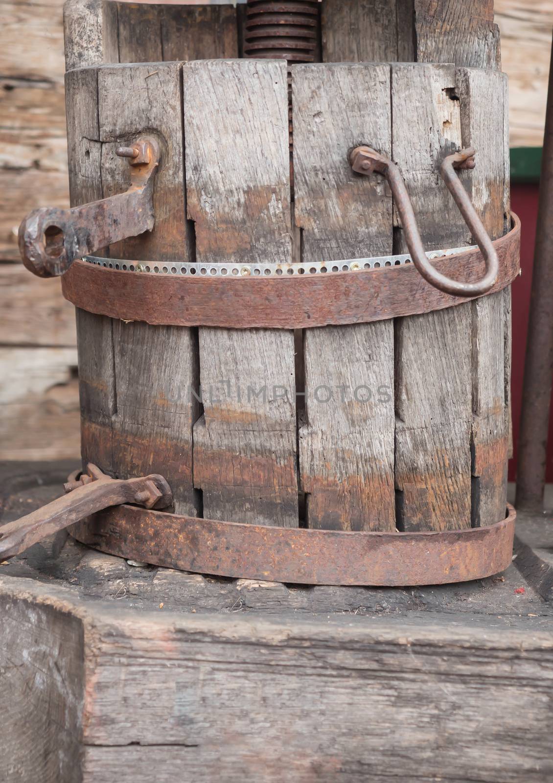 A historic wooden bucket with an iron ring by sandra_fotodesign