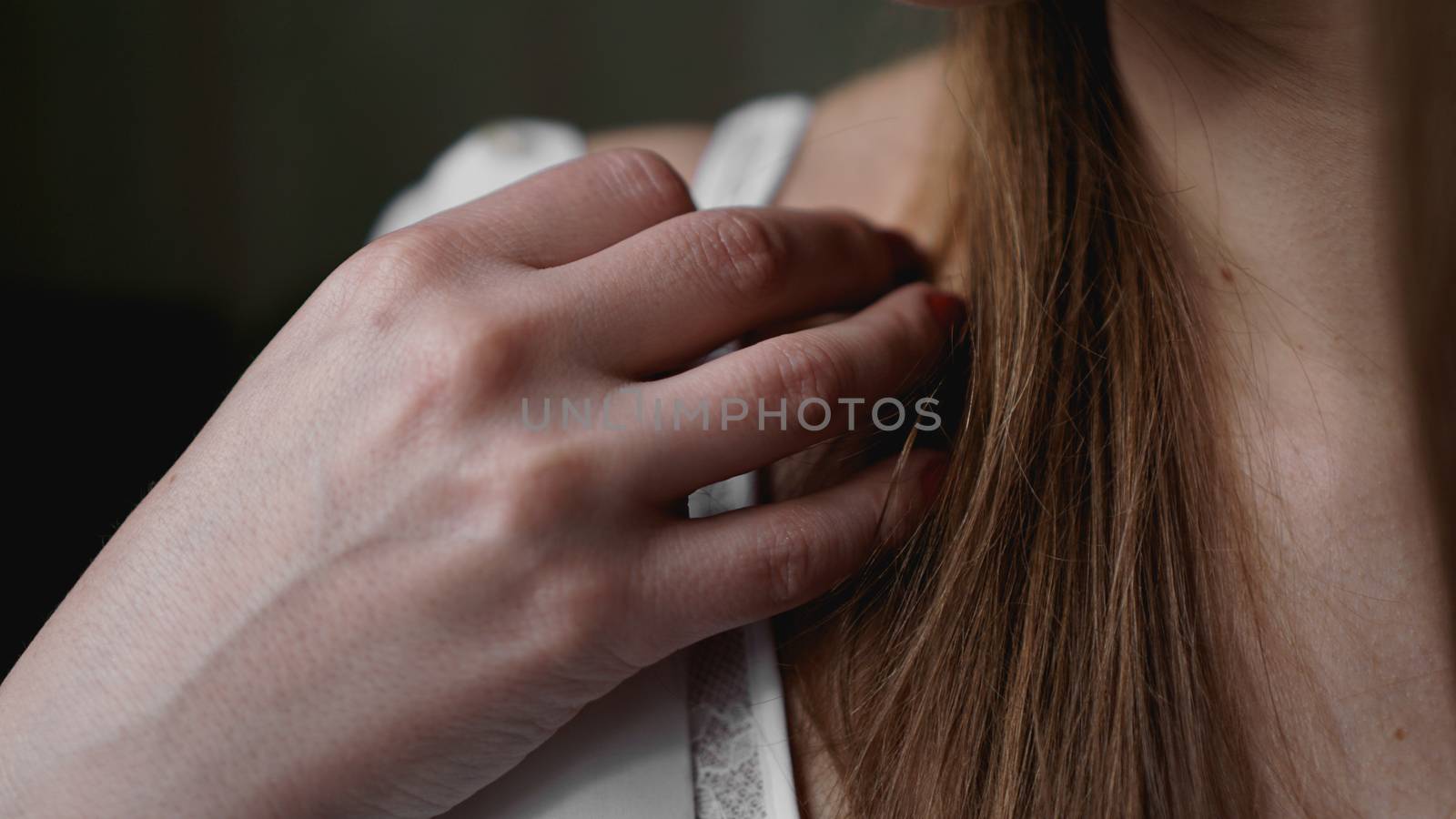 Hands of woman undressing white bra by natali_brill