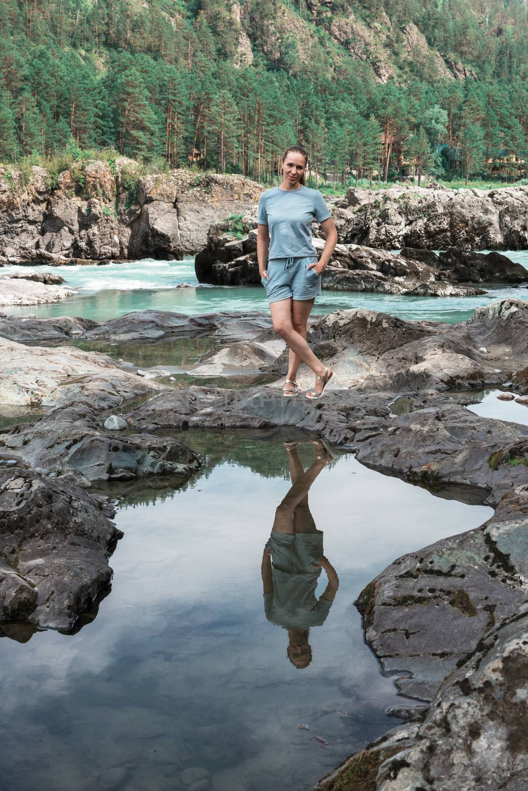 Woman at river in Altai Mountains territory