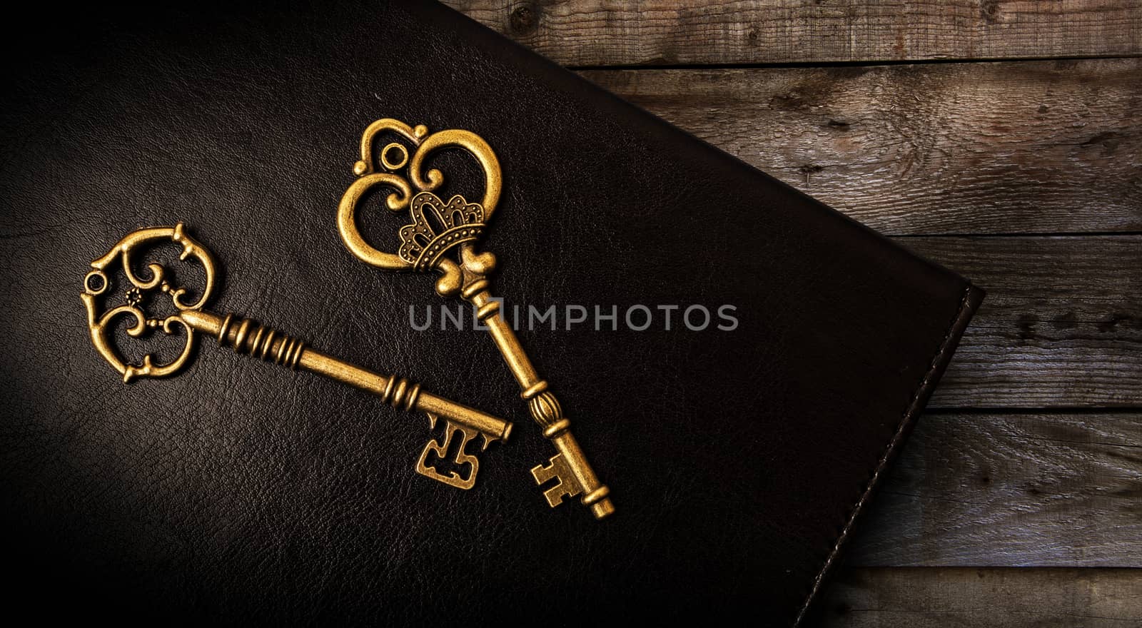 Old keys on the dark background of the skin