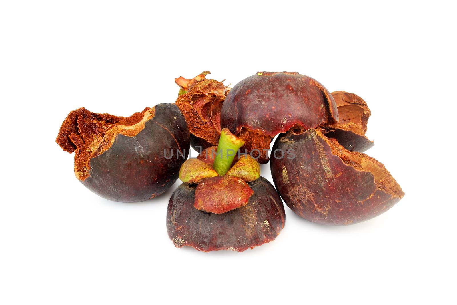 The mangosteen peel is exposed to the sun until dry.With Clipping Path. by thitimontoyai