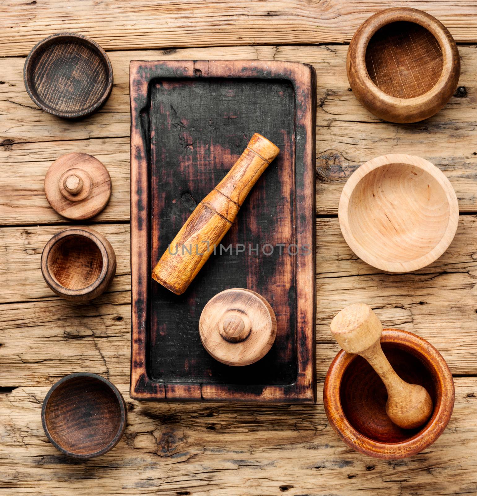 Empty wooden mortar and pestle on wooden old background.Cooking utensils