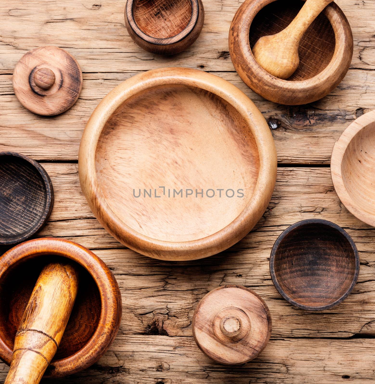 Empty wooden mortar and pestle on wooden old background.Cooking utensils