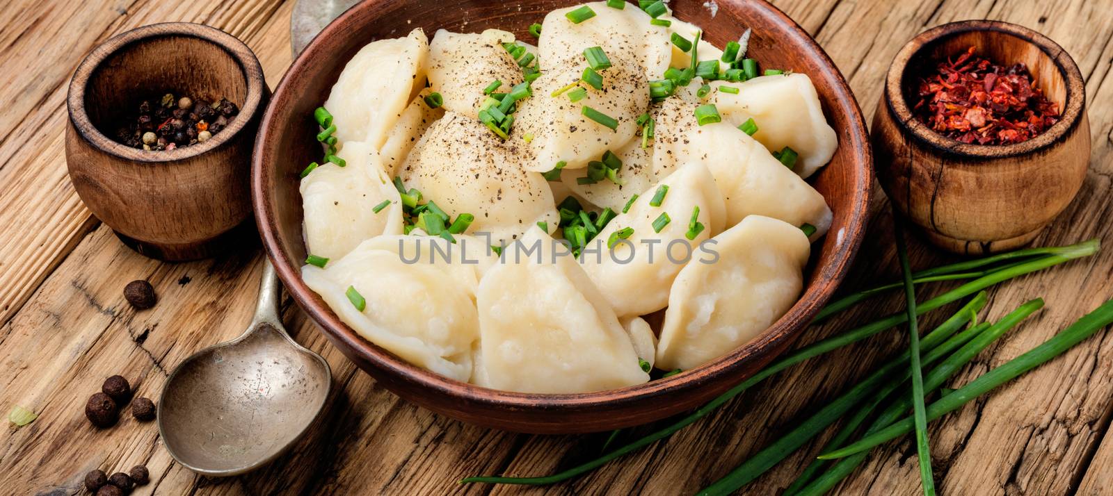 Dumplings with potatoes in plate by LMykola