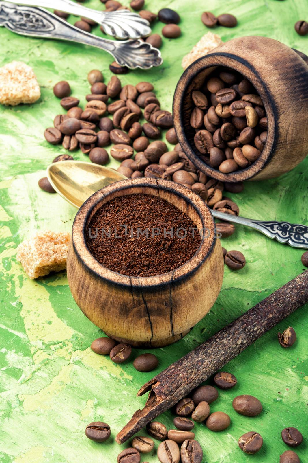 Roasted coffee beans and ground coffee.Coffee on green background