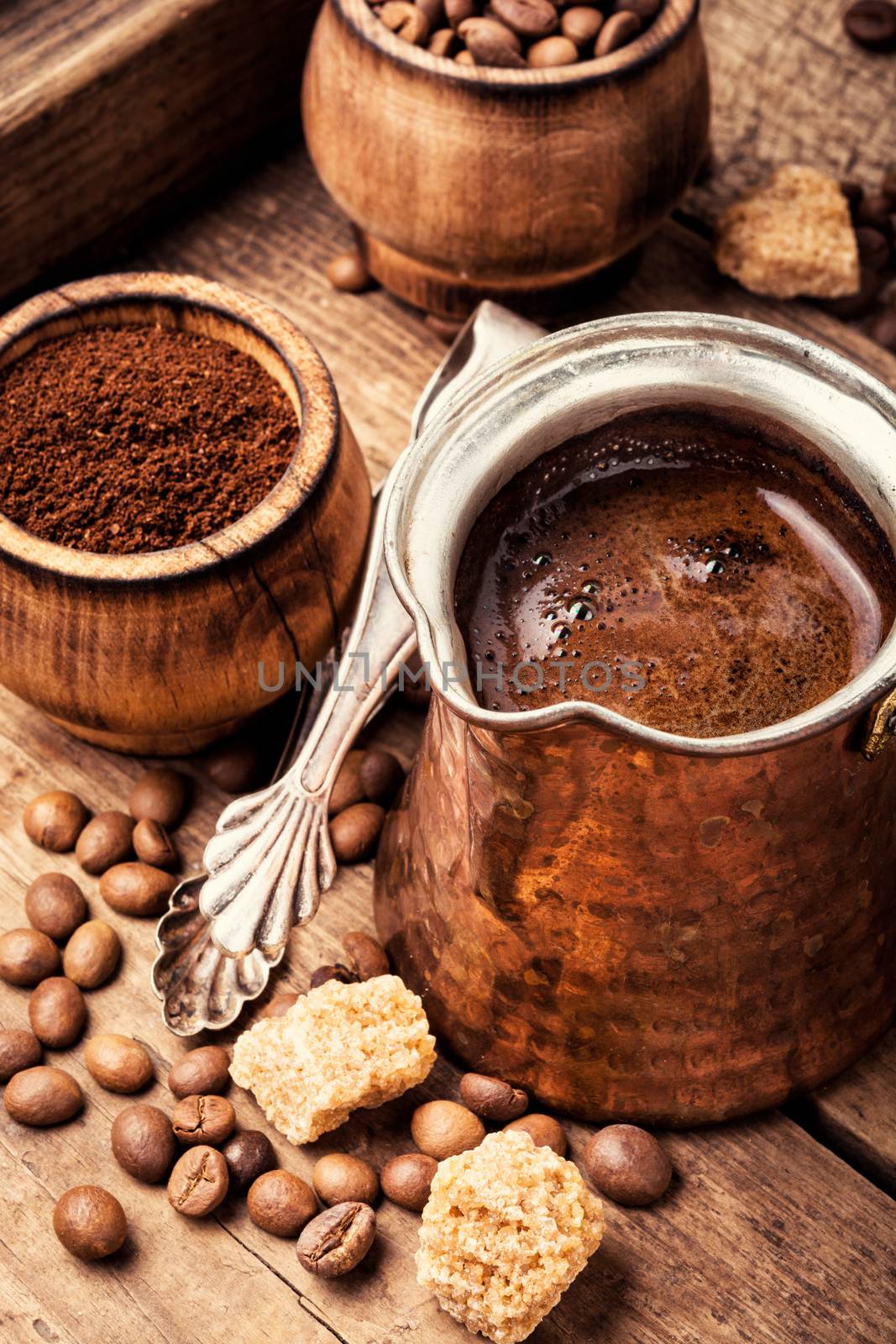 Roasted coffee beans and ground coffee.Coffee beans on wood background