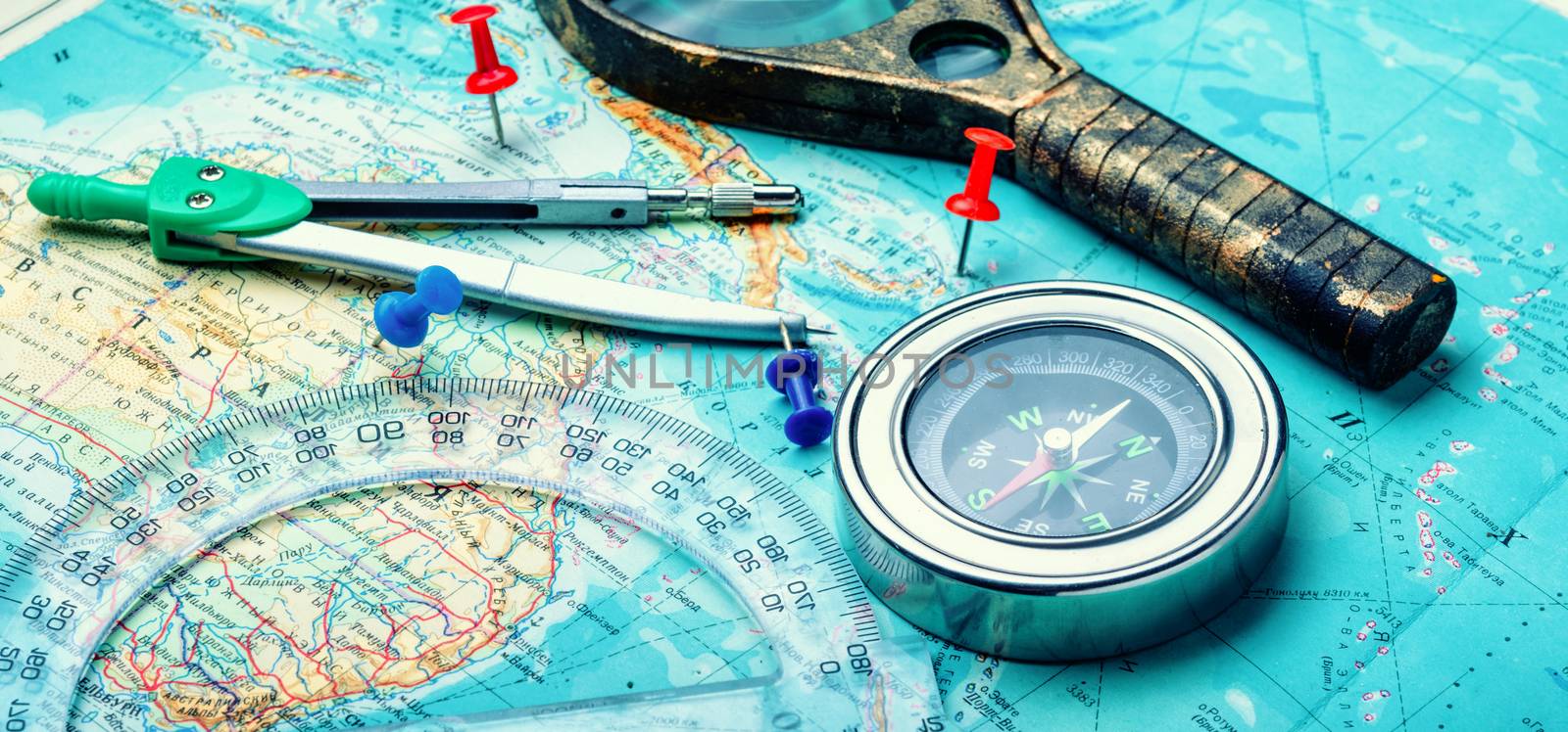 Retro compass with vintage map.Travel planning concept on map