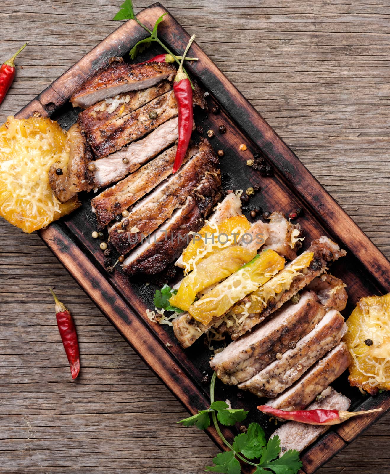 Juicy beef steak slices on wooden board