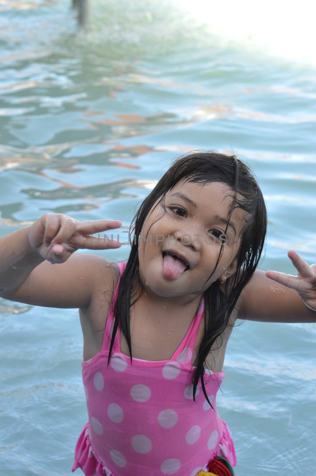 Asian little girl in the pool