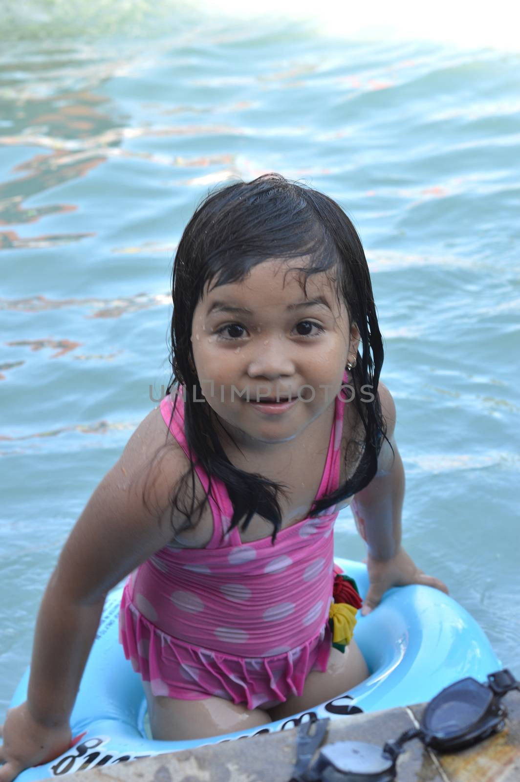 Asian little girl in the pool