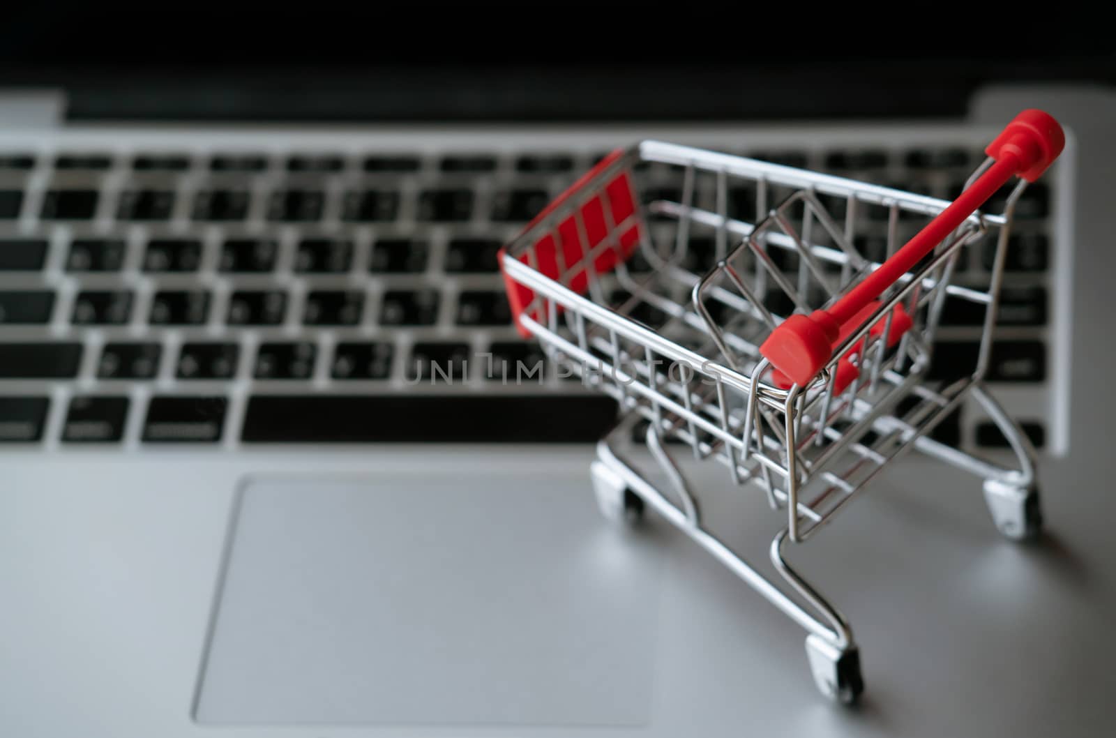 shopping cart on laptop, online shopping concept