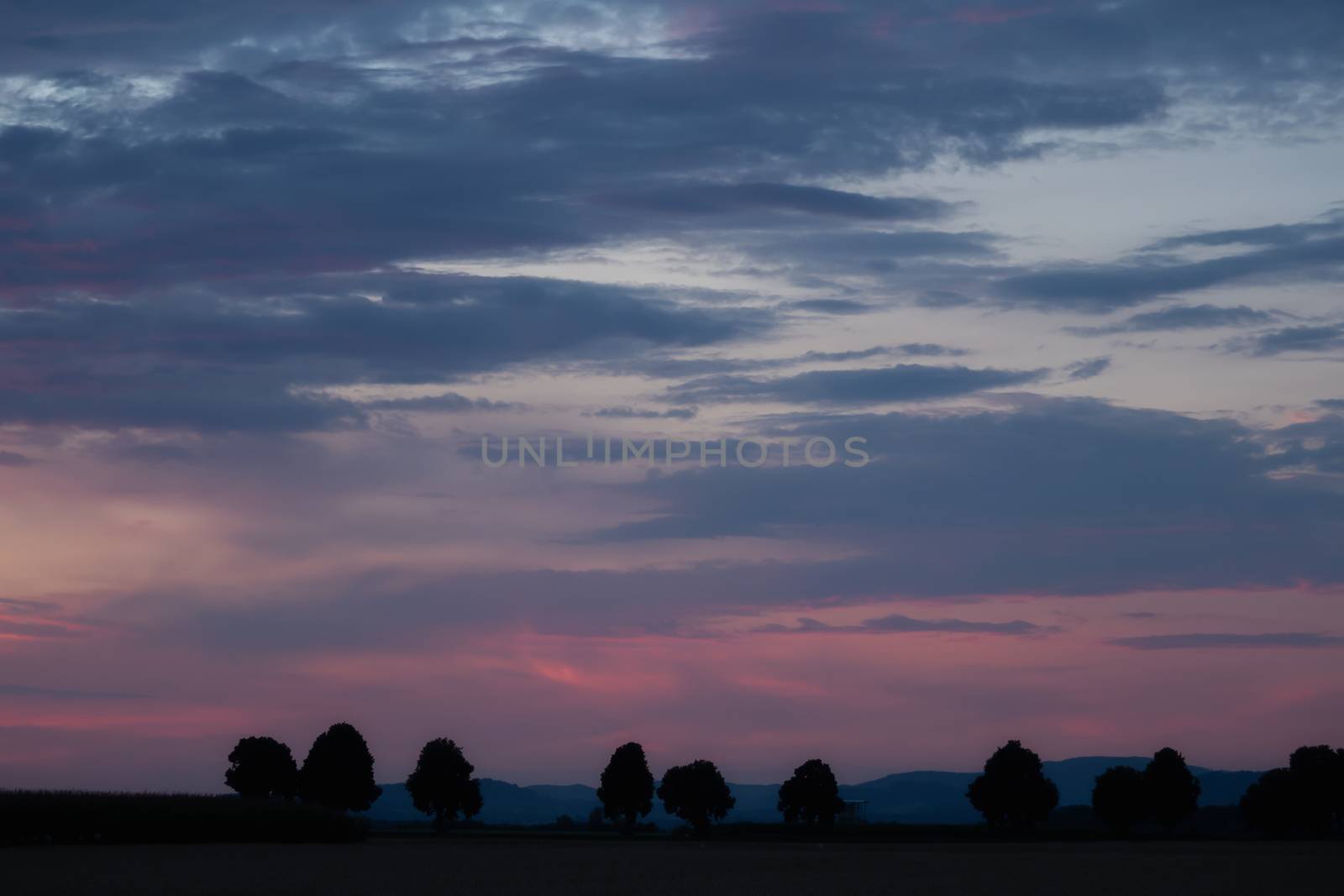 Romantic sunset with black silhouette in the foreground