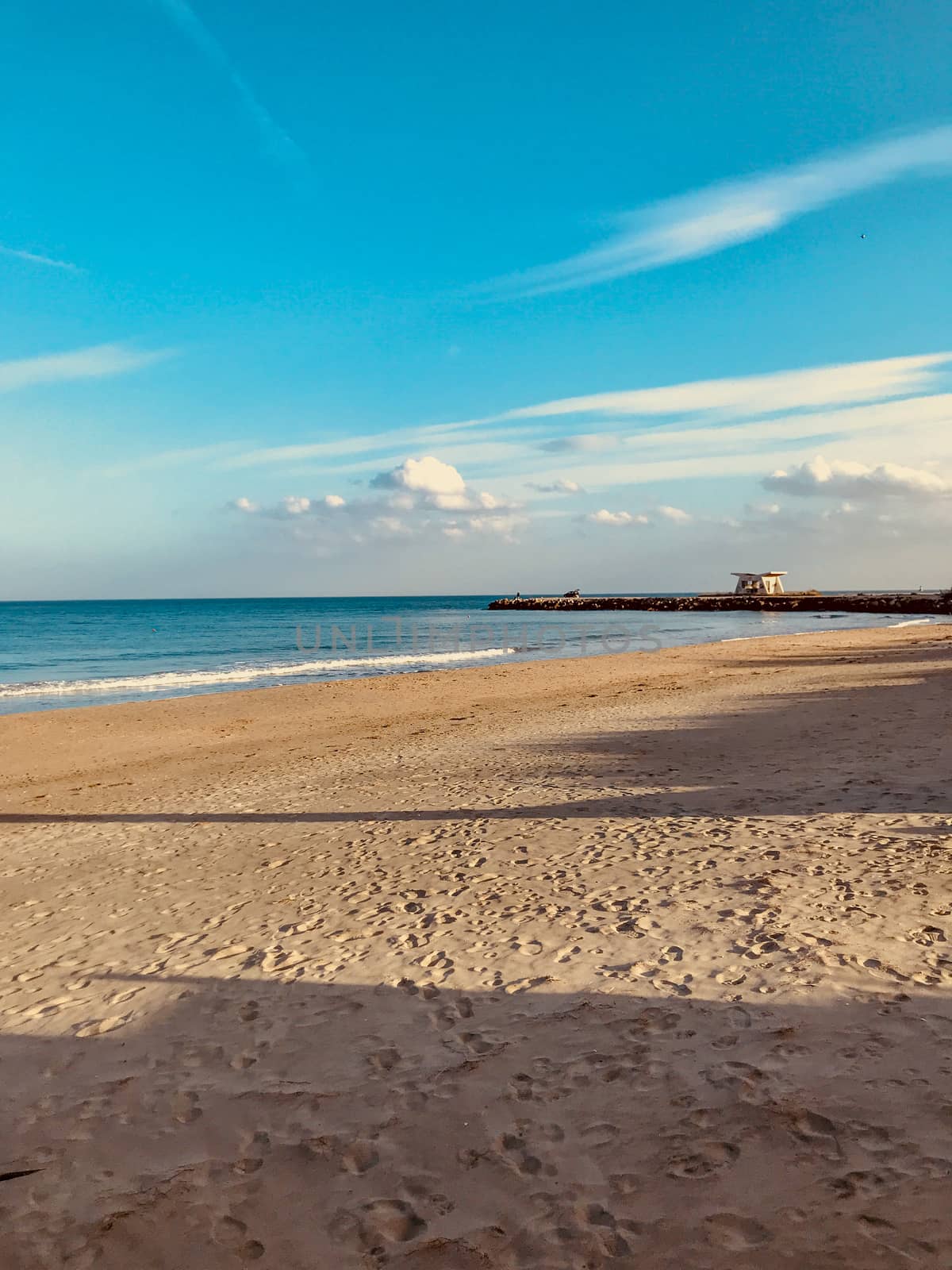 Scenic View Of Sea Against Clear Blue Sky and Sunlight