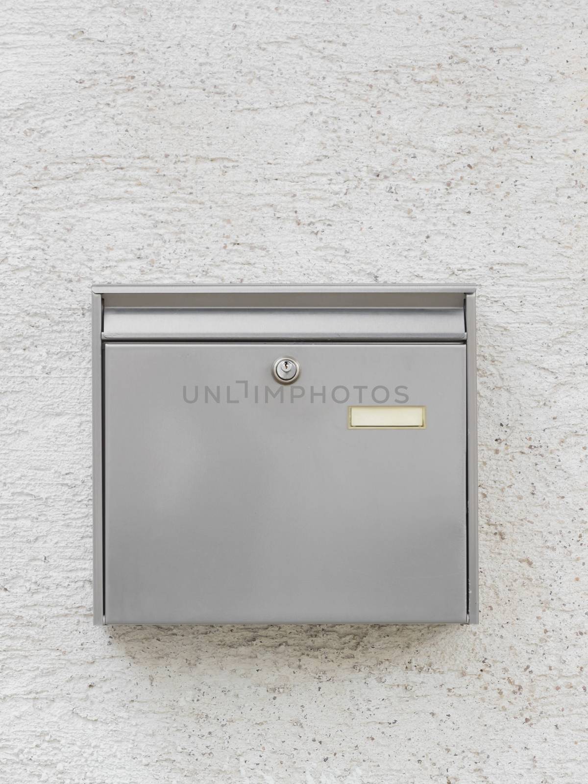 A silver mailbox on the wall