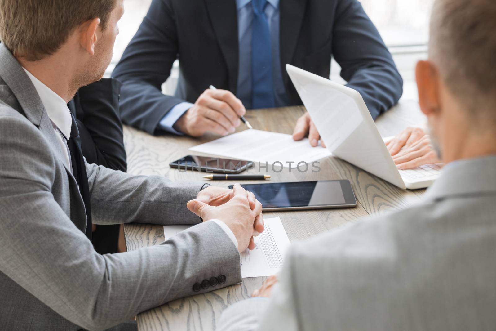 Business man signing contract at office table