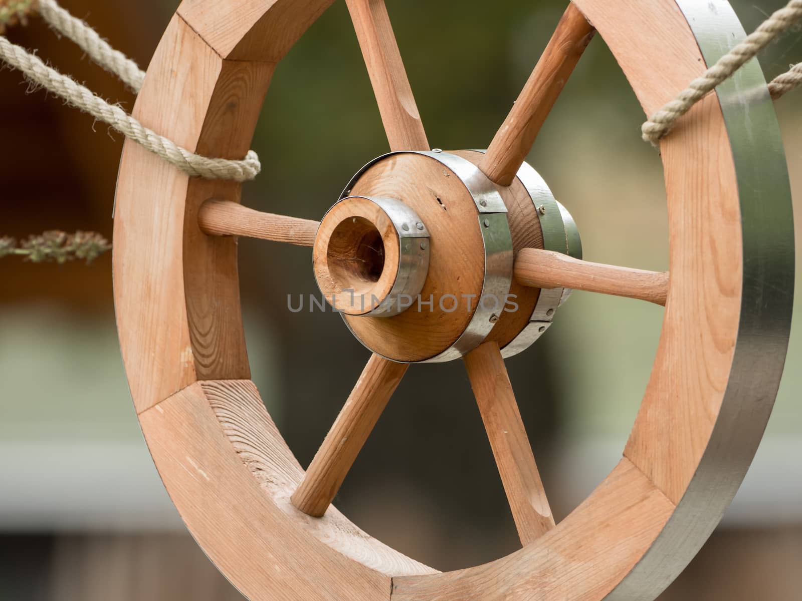 A wooden wheel hangs out as a decoration