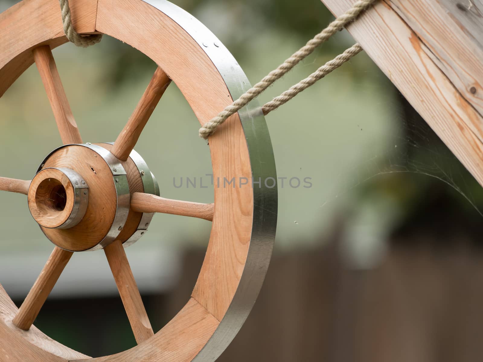 A wooden wheel hangs out as a decoration