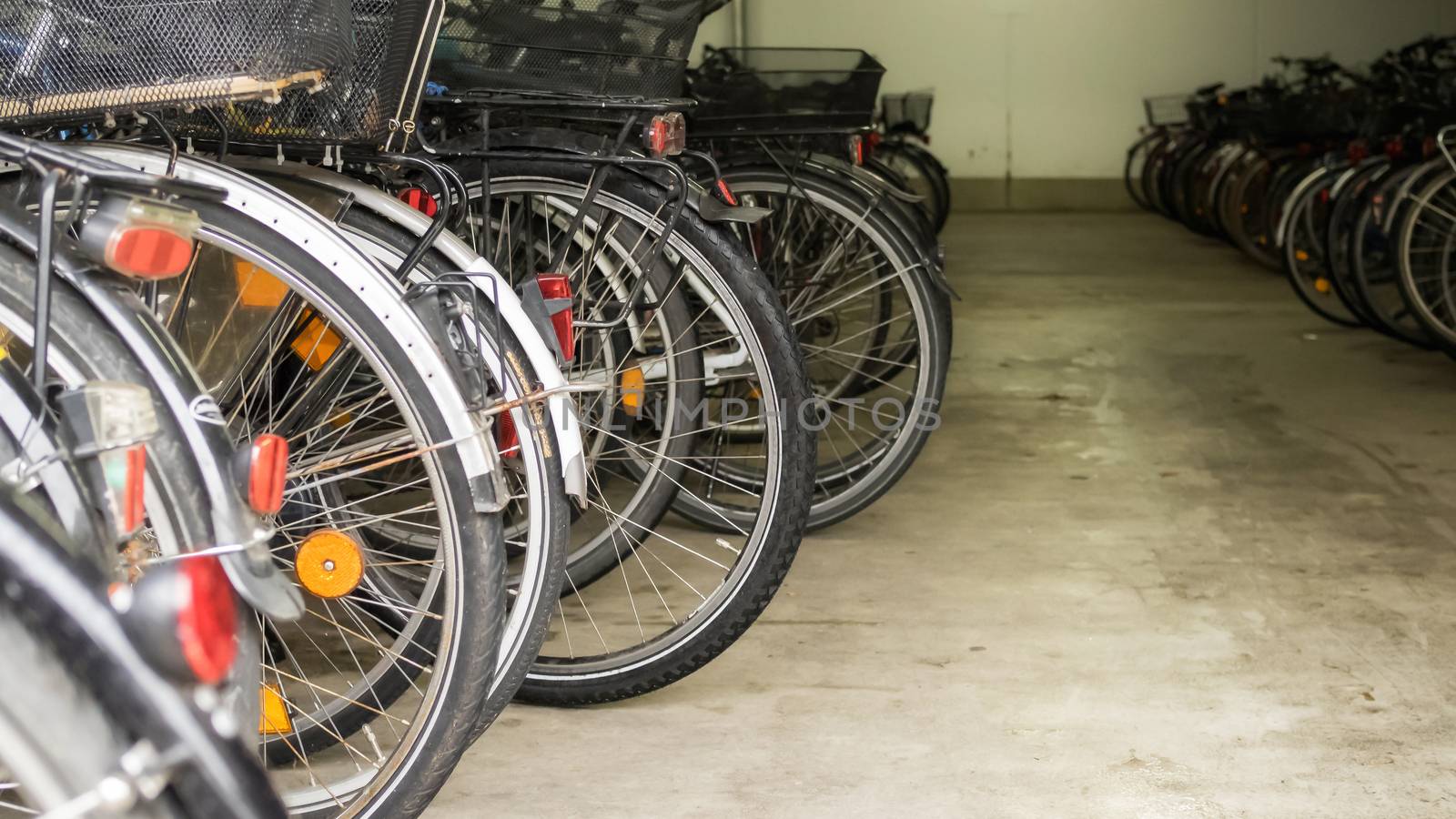 Many parked bicycles in a garage