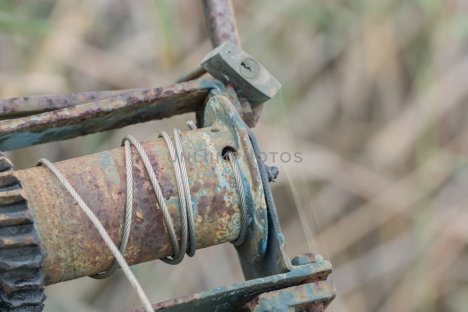 Old, rusty winch with soft bokeh