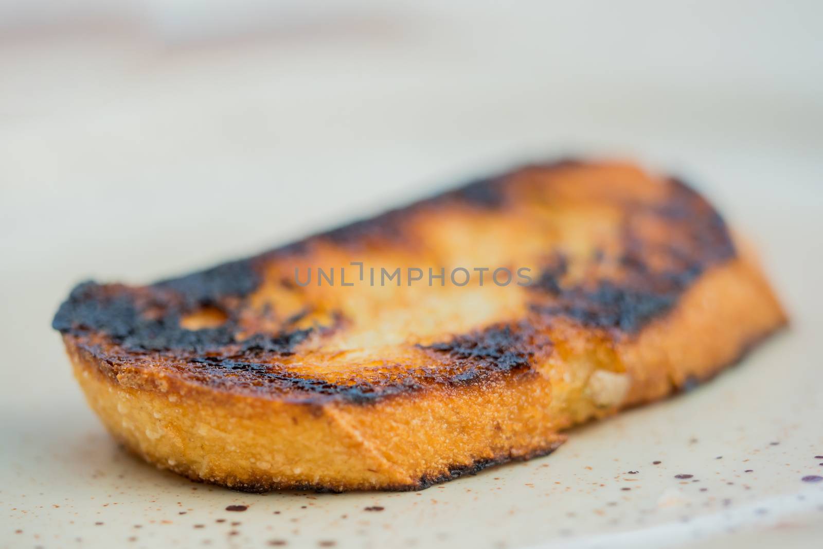 Toasted slice of white bread from the grill by sandra_fotodesign