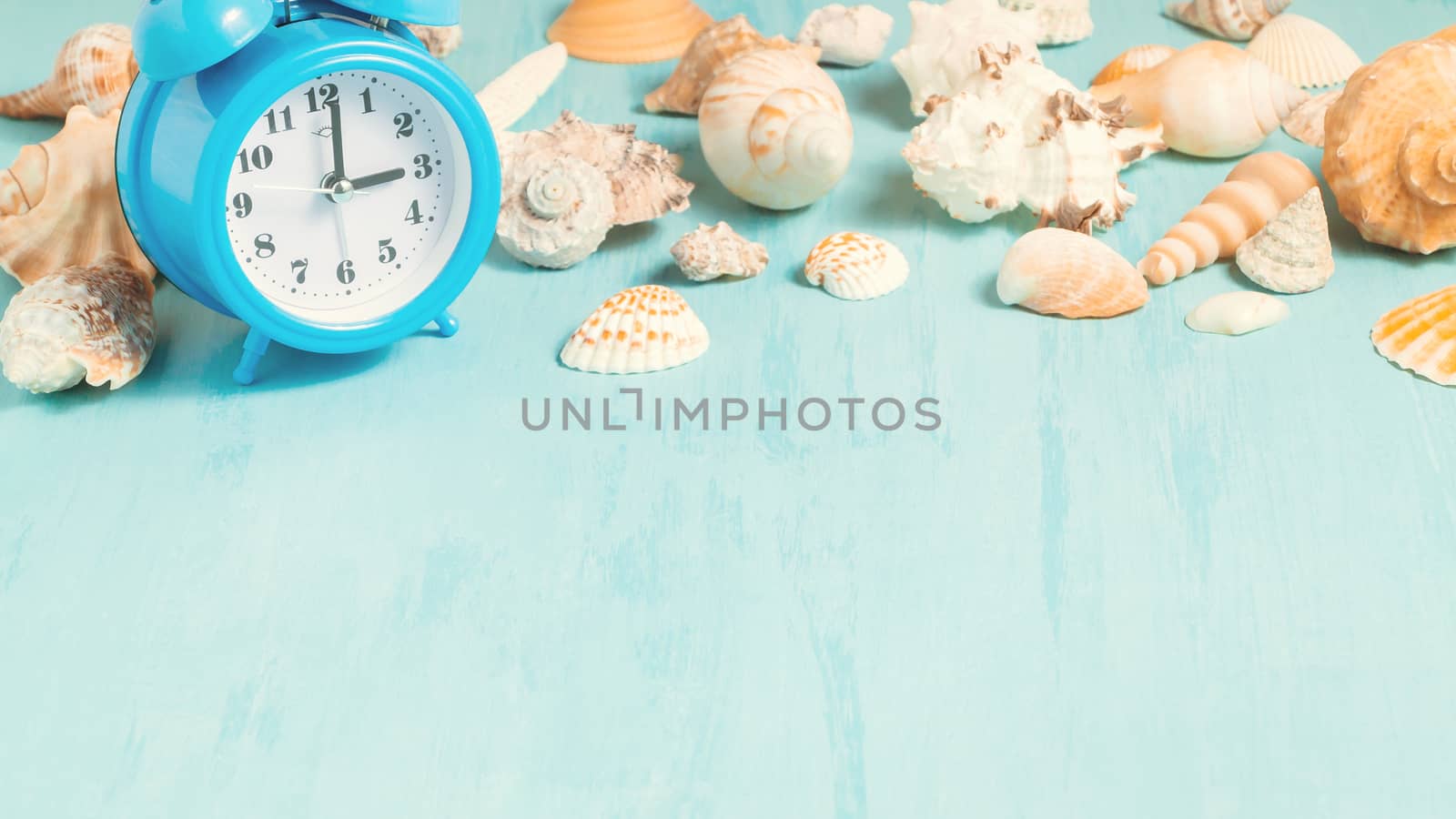 Blue sea background with alarm clocks and seashells, summer holiday and vacation time concept by galsand