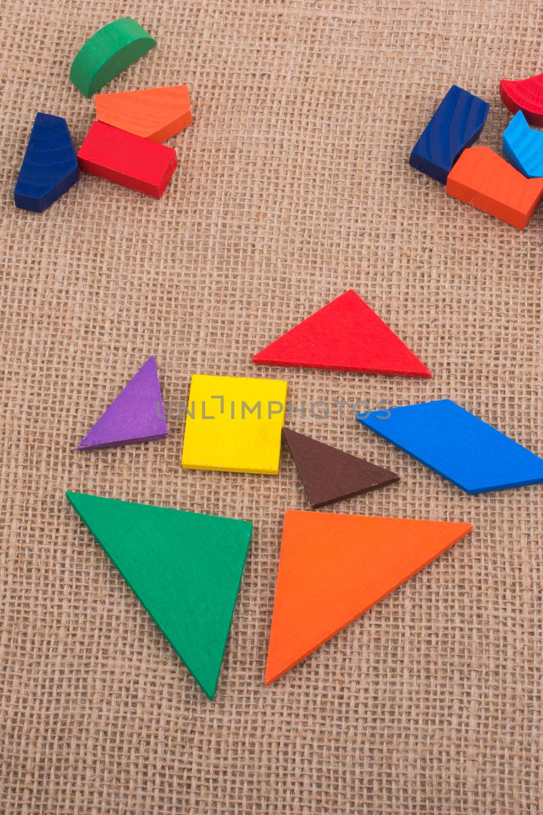Colorful pieces of a square tangram puzzle