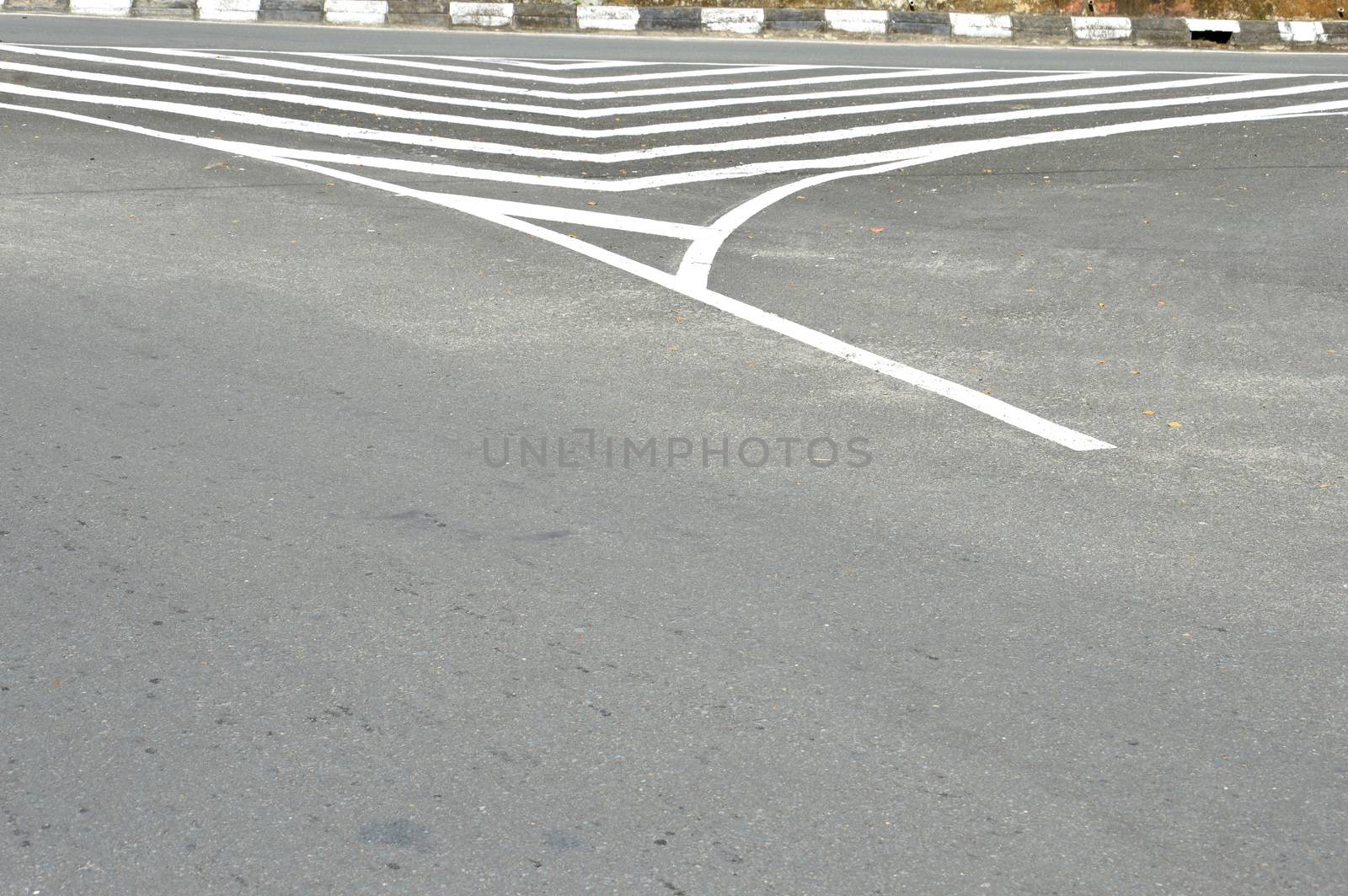 stripes on asphalt road by antonihalim