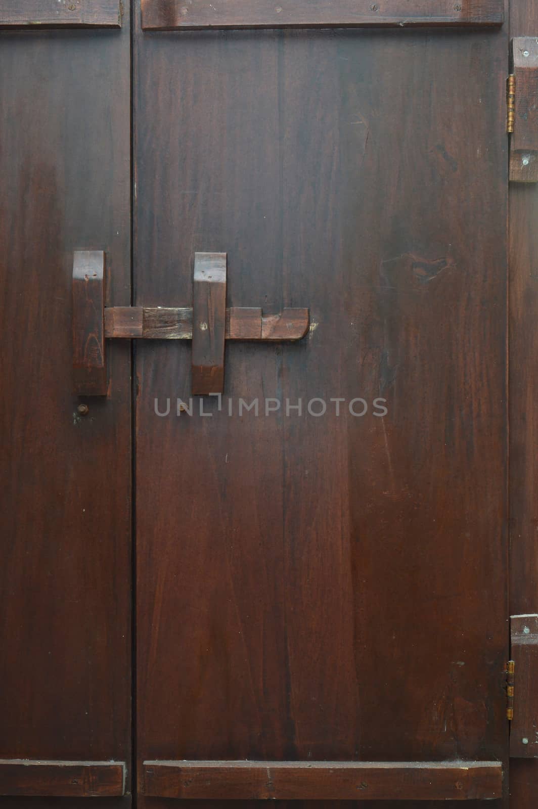wooden lock bar on the wooden door