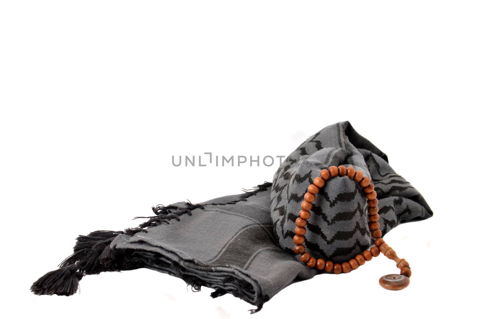 black turban and brown rosary on white background