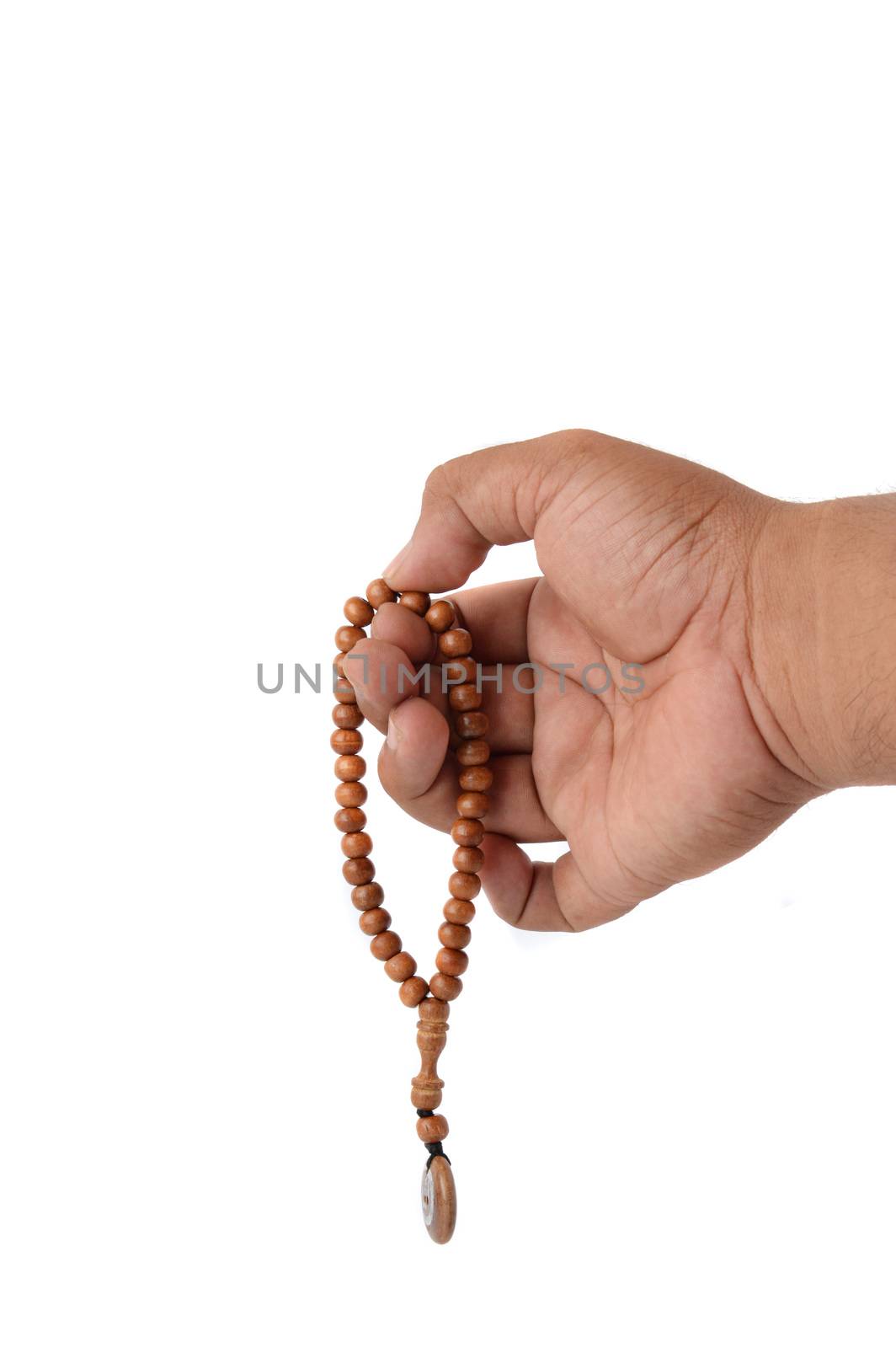 Muslim male hands holding rosary by antonihalim