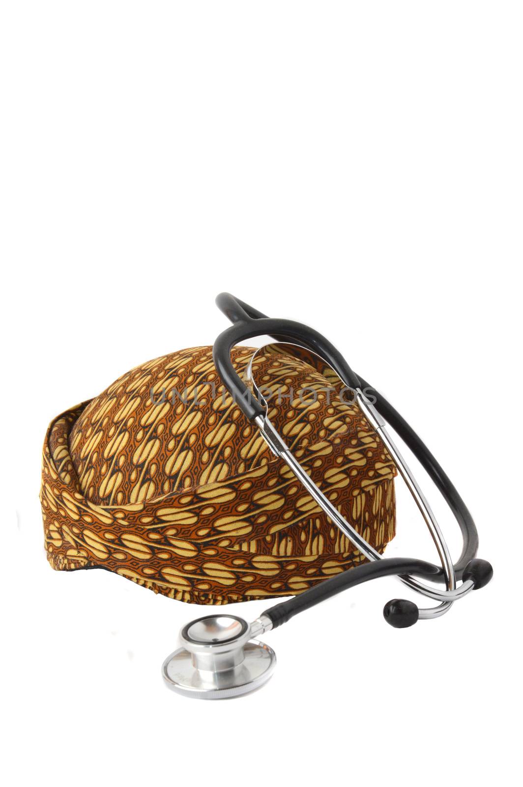 blangkon a traditional hat Javanese men with stethoscope on white background