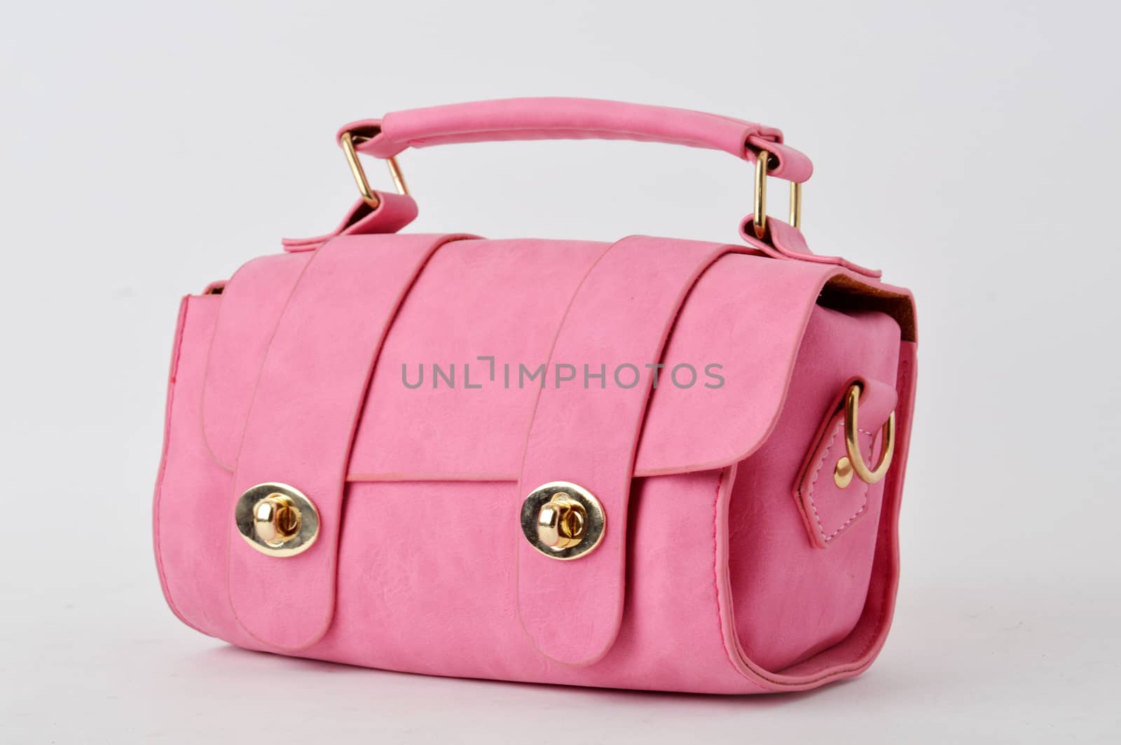 pink leather bag on white background