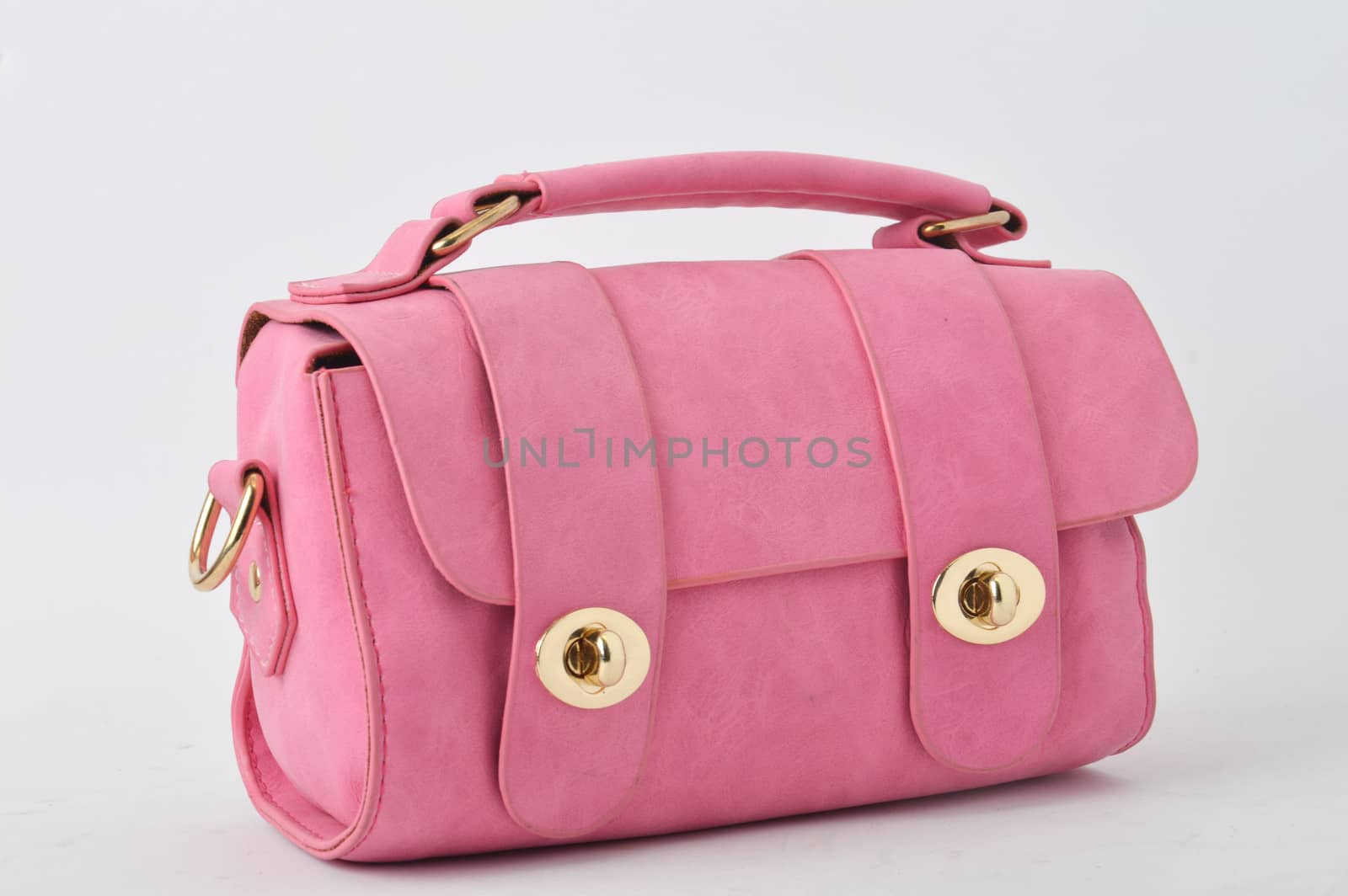 pink leather bag on white background