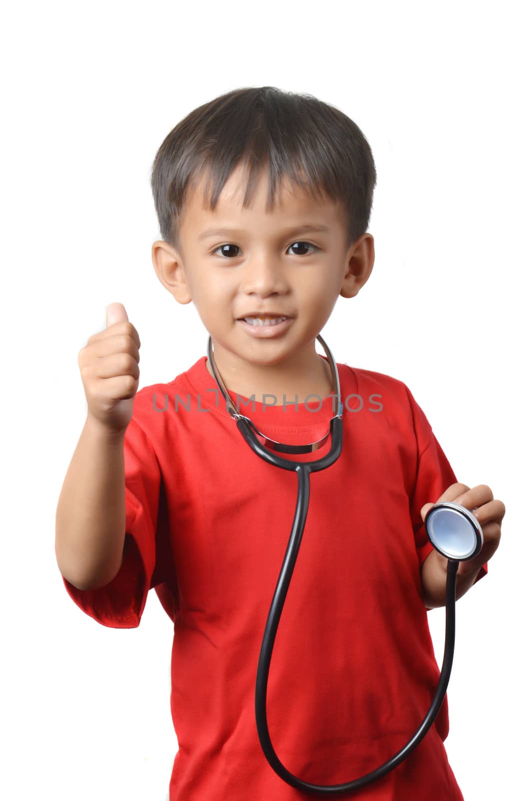 asian little boy holding a stethoscope by antonihalim