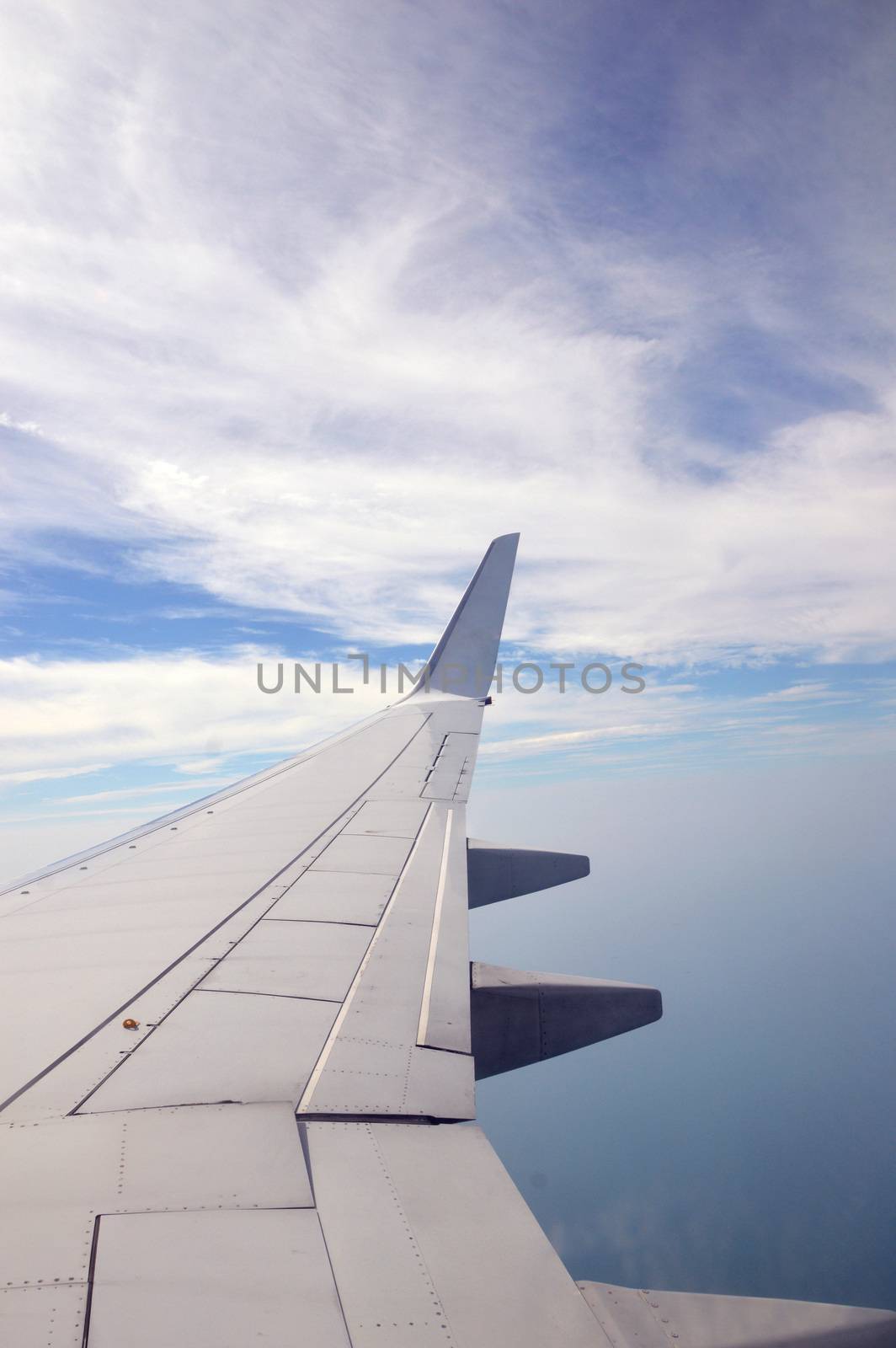 View of beautiful cloud and wing of airplane from window