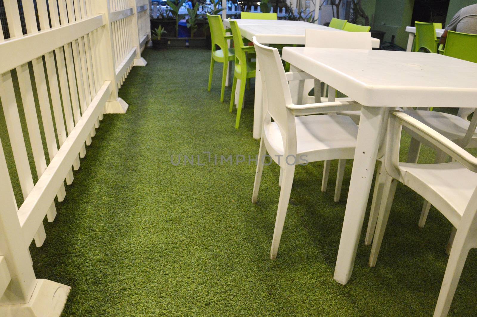 plastic table set on the fake grass