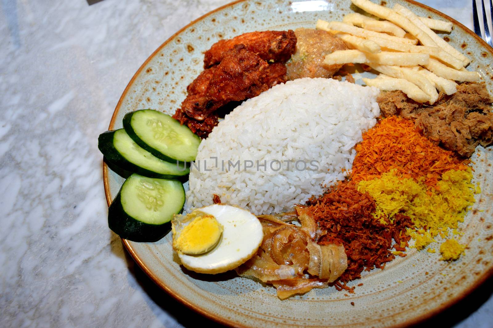 Indonesian rice mix on the ceramic plate 