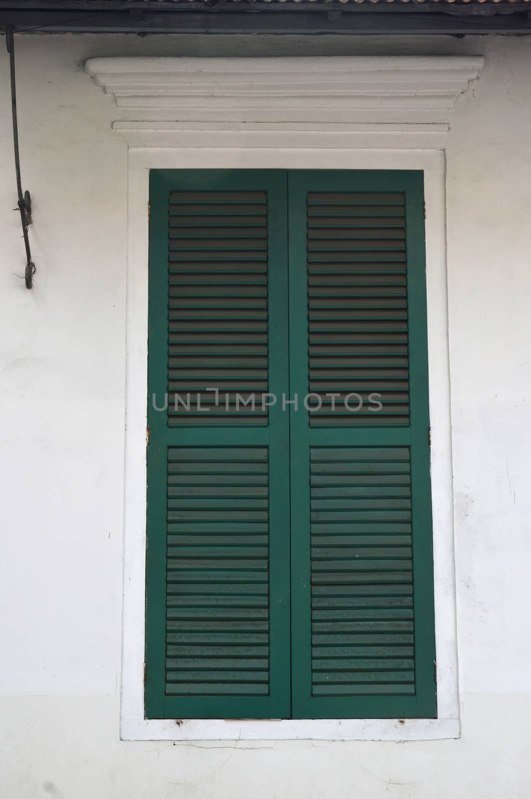 the old green wooden window at Kota Tua Jakarta, Indonesia