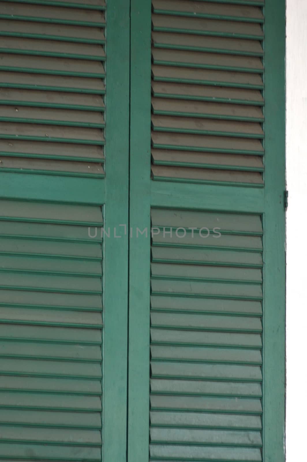 the old green wooden window at Kota Tua Jakarta, Indonesia