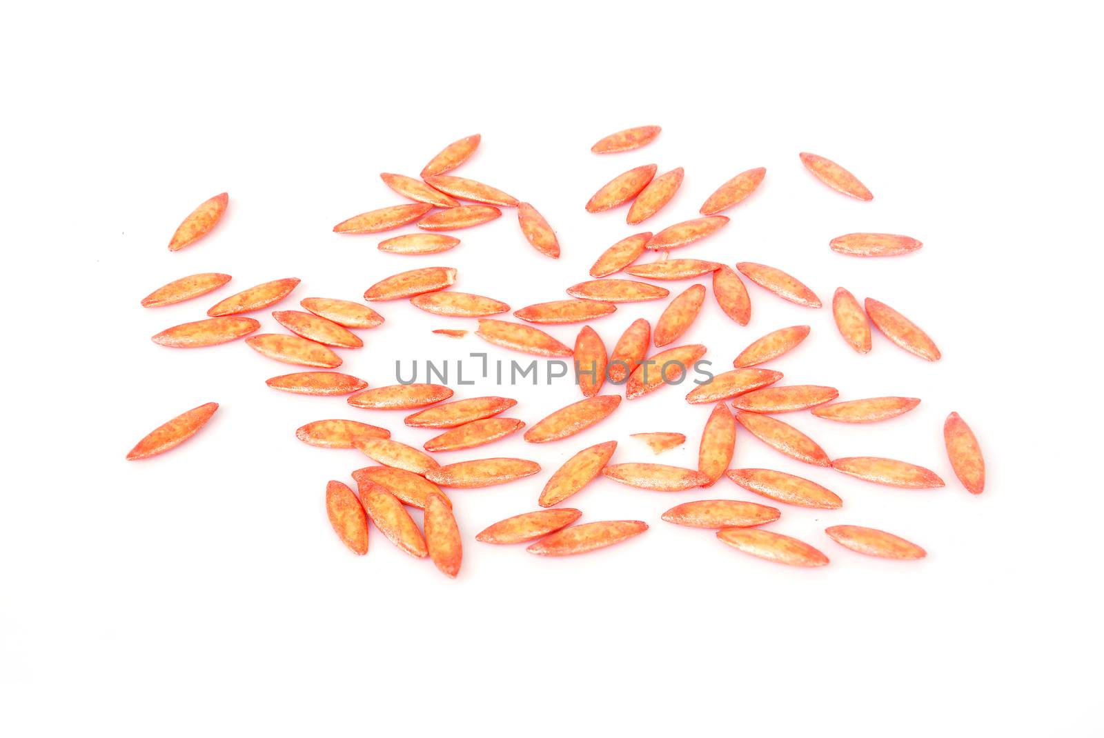 Cucumber seeds coating accelerate on white background.