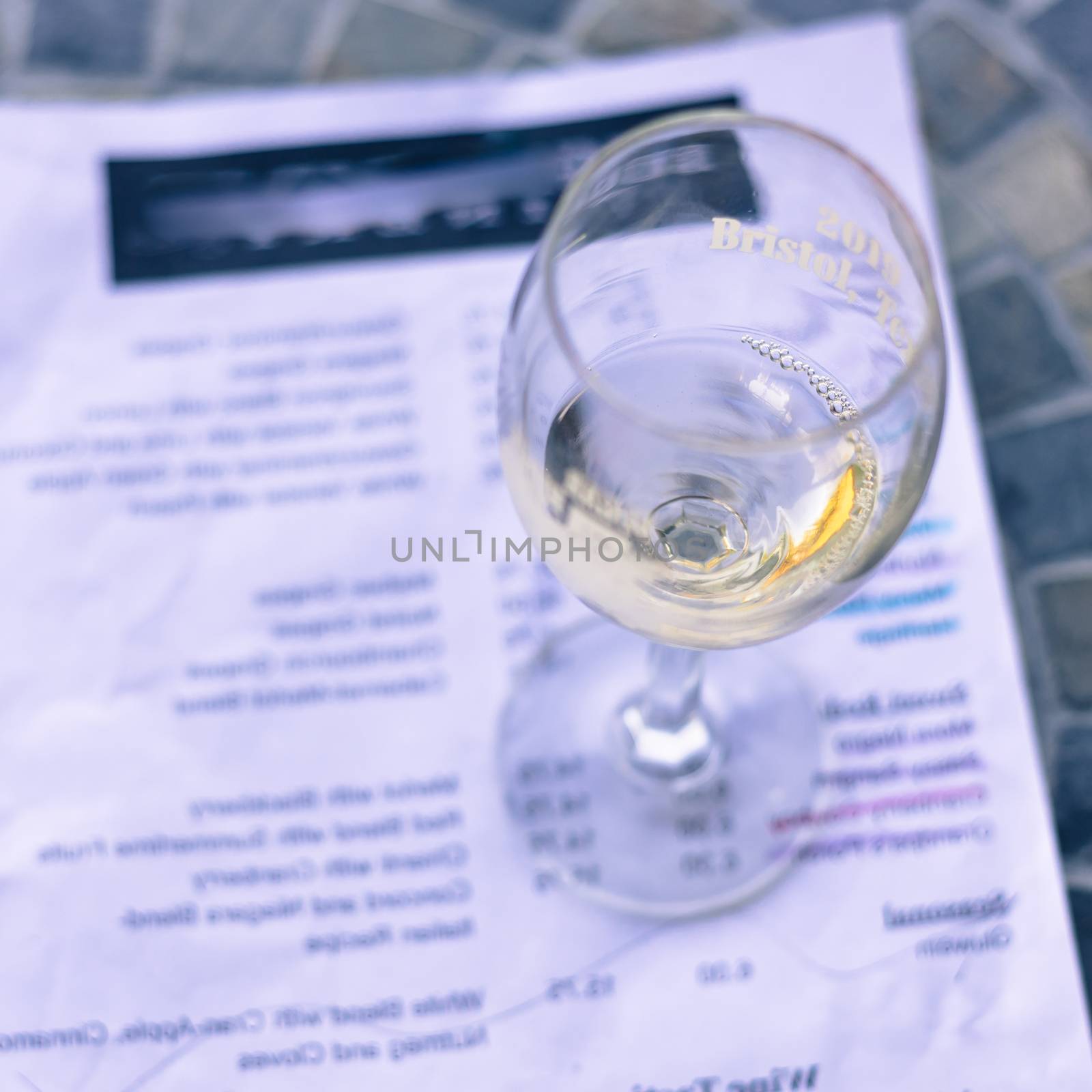 Filtered image wine taste concept with glass of dry white wine a by trongnguyen