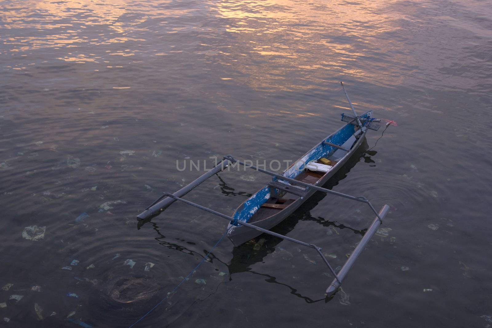 small wooden fisherman boat at the sea