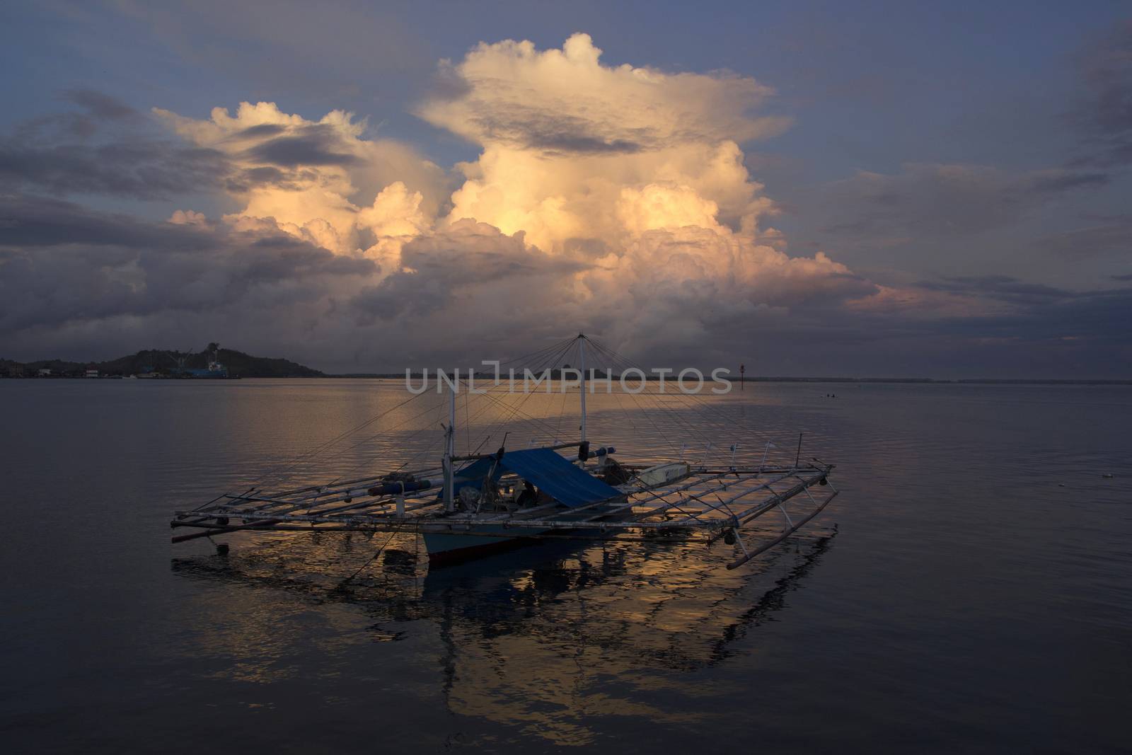 small wooden fisherman boat at the sea