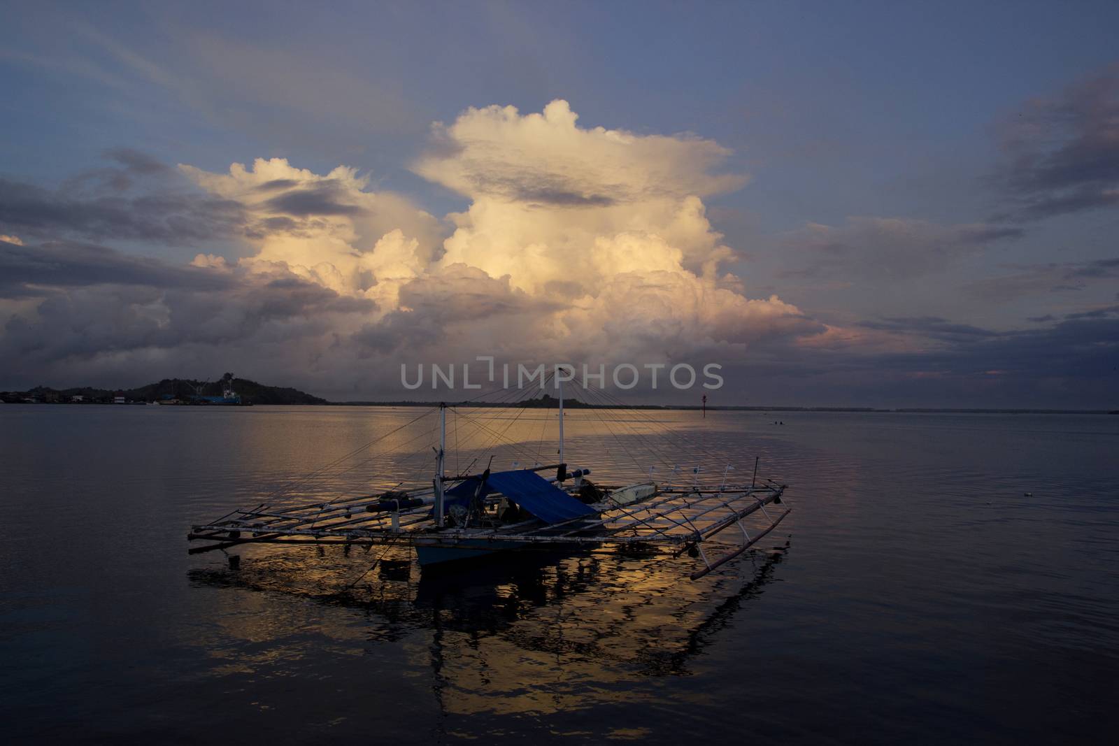 small wooden fisherman boat at the sea