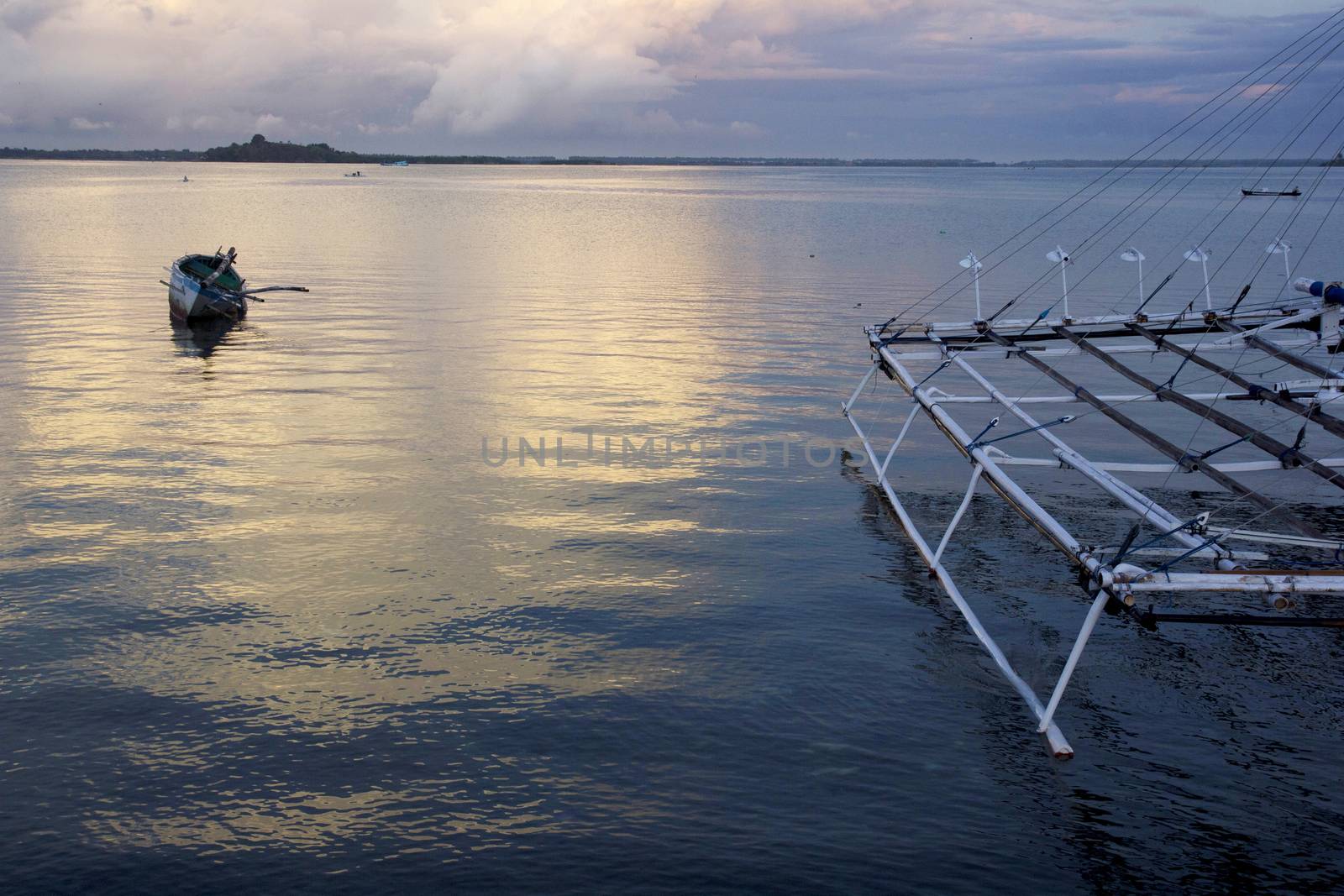 small wooden fisherman boat at the sea