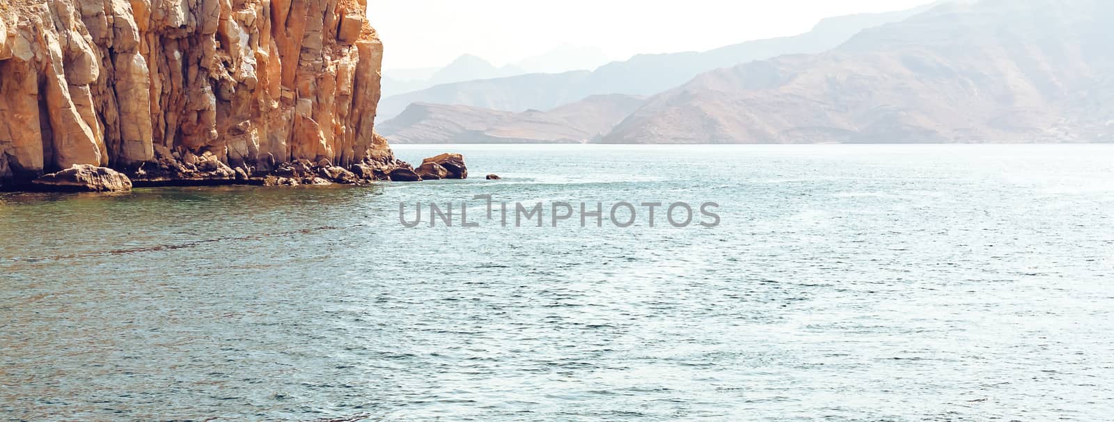 Sea and rocky shores in the fjords of the Gulf of Oman, panoramic view by galsand