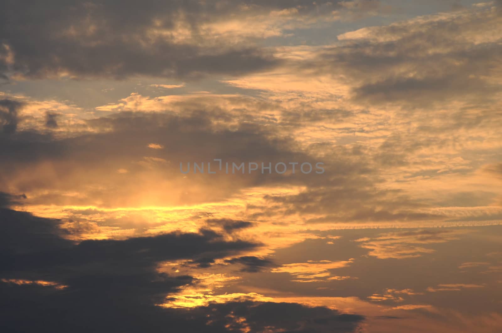 Dramatic sunset sky background with fiery clouds natural background