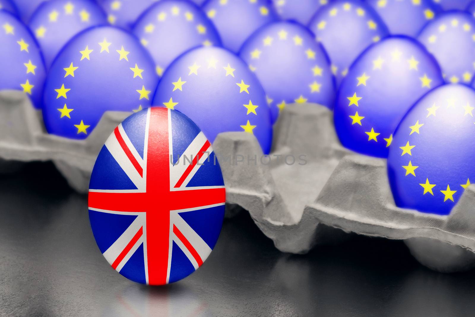 Concept of Brexit is presented from jumping egg with a British flag out of the box with eggs with the flag of the European Union by galsand