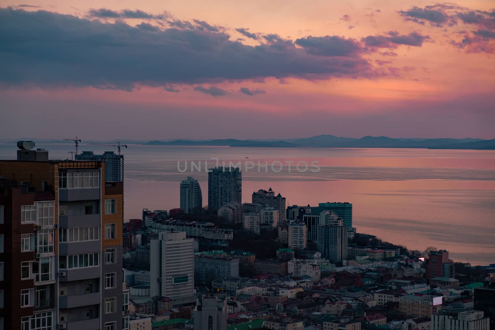 Panoramic view of the city of Vladivostok against the sunset. by rdv27