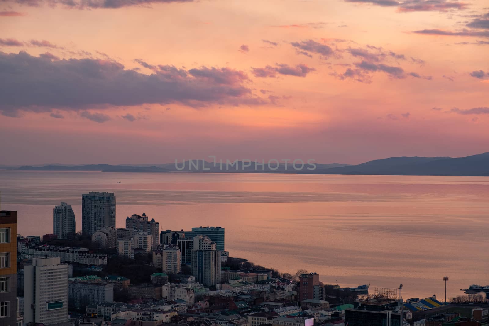 Panoramic view of the city of Vladivostok against the sunset. by rdv27